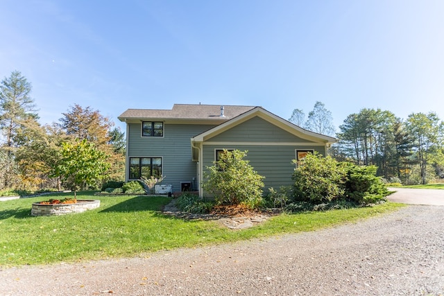 view of home's exterior with a lawn