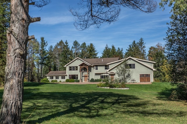 raised ranch featuring a front lawn