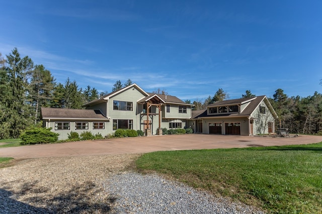 view of front of home featuring a garage and a front lawn