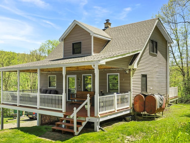 543 Drybrook Rd, Waverly, NY 14892 - rear view of house featuring roof with shingles, covered porch, heating fuel, a chimney, and a lawn