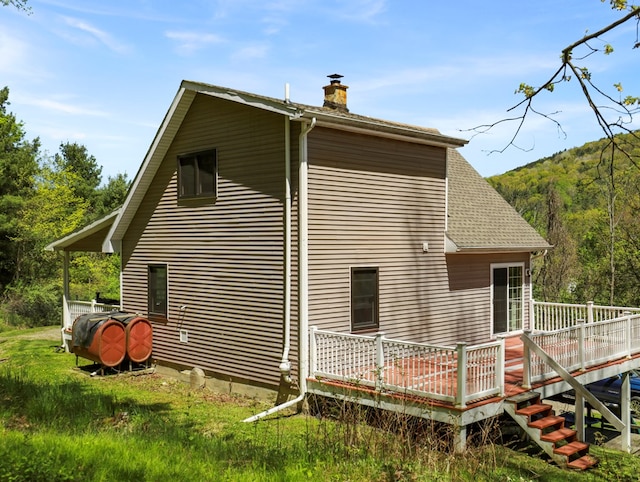 543 Drybrook Rd, Waverly, NY 14892 - view of property exterior with a chimney, a deck, and roof with shingles