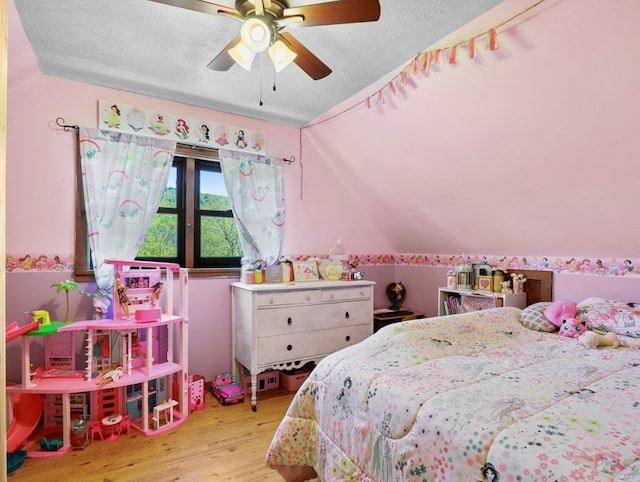 543 Drybrook Rd, Waverly, NY 14892 - bedroom with wood finished floors, lofted ceiling, a textured ceiling, and a ceiling fan