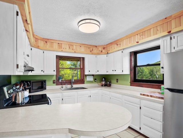 543 Drybrook Rd, Waverly, NY 14892 - kitchen featuring freestanding refrigerator, a sink, black microwave, range with electric cooktop, and a textured ceiling