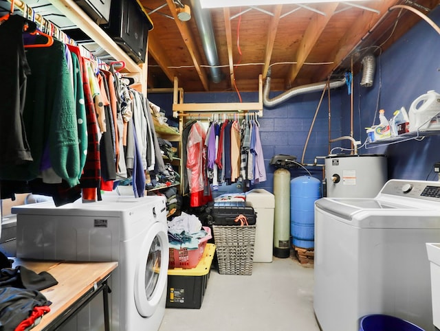 543 Drybrook Rd, Waverly, NY 14892 - clothes washing area featuring washer and dryer, water heater, and concrete block wall