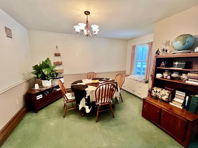 carpeted dining room featuring a chandelier