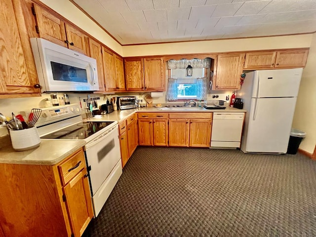 kitchen featuring sink and white appliances