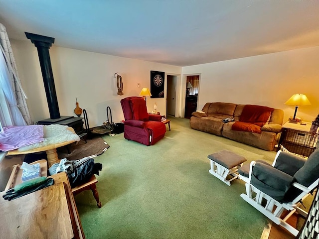 carpeted living room with a wood stove