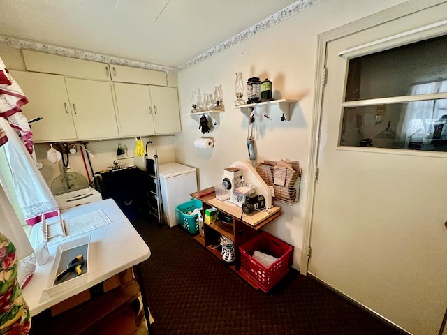 washroom featuring cabinets