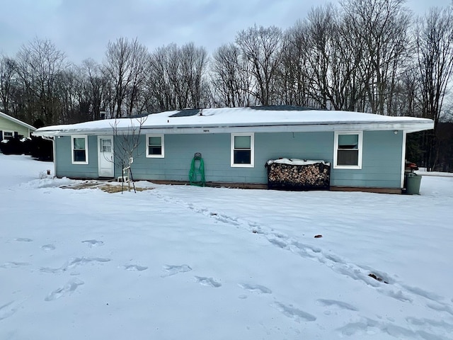 view of snow covered house