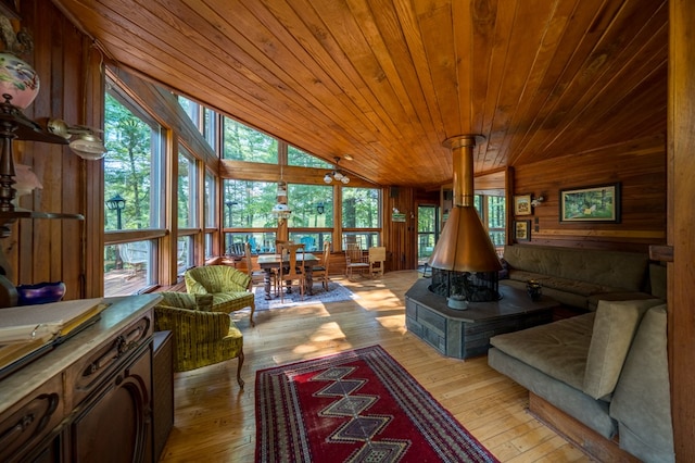 interior space with wooden ceiling, a healthy amount of sunlight, and lofted ceiling