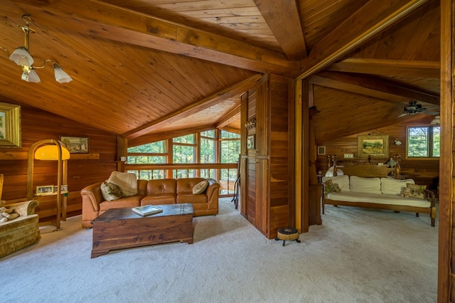 carpeted living room featuring vaulted ceiling with beams, wood walls, and wood ceiling