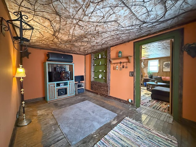 living room with an ornate ceiling and baseboards