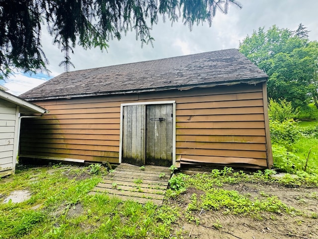 96 E St, Towanda, PA 18848 - back of property featuring an outbuilding and roof with shingles