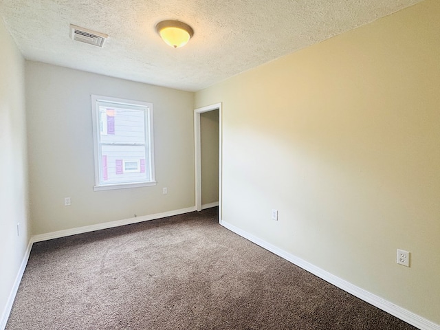96 E St, Towanda, PA 18848 - unfurnished room with a textured ceiling, carpet floors, and baseboards