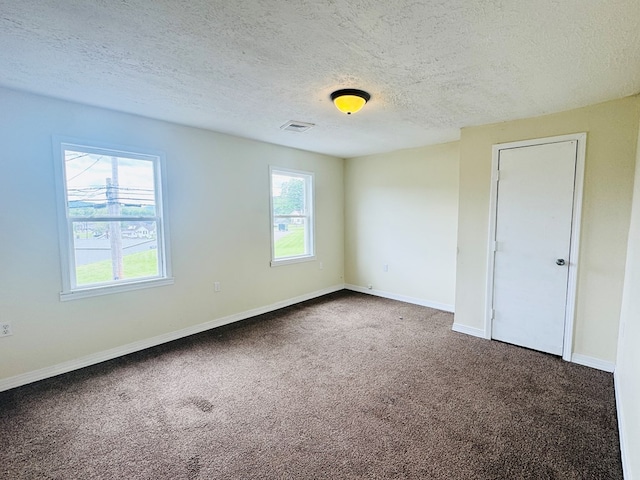 96 E St, Towanda, PA 18848 - carpeted empty room featuring baseboards and a textured ceiling