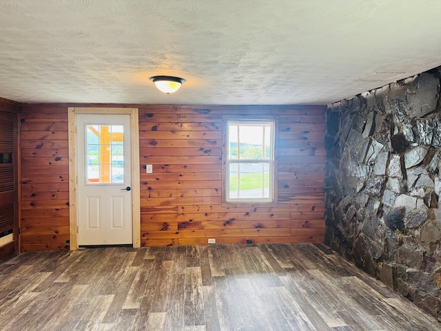 96 E St, Towanda, PA 18848 - entryway with wood finished floors, a textured ceiling, plenty of natural light, and wooden walls