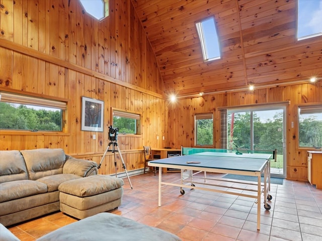 game room with light tile patterned flooring, wooden ceiling, high vaulted ceiling, and a skylight