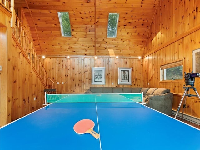 playroom featuring high vaulted ceiling, wood ceiling, and wooden walls