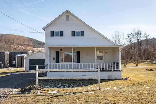 view of front of house featuring a porch and a front lawn