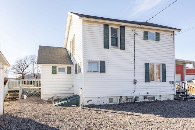 rear view of house with a deck