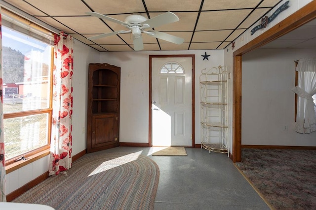 foyer with a paneled ceiling and ceiling fan