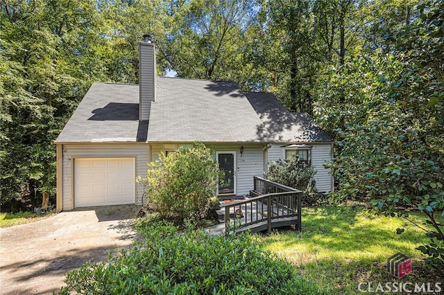 cape cod-style house featuring a wooden deck and a garage