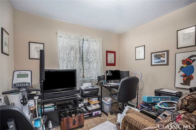 tiled office space featuring a wood stove