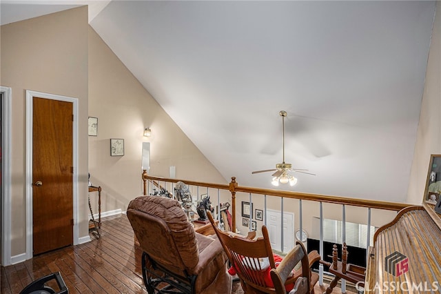 interior space featuring dark hardwood / wood-style floors, ceiling fan, and lofted ceiling