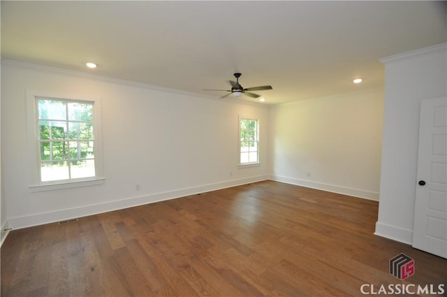 unfurnished room with crown molding, ceiling fan, and dark hardwood / wood-style floors