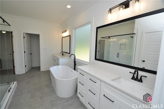 bathroom with tile patterned flooring, vanity, separate shower and tub, and ornamental molding