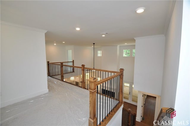 hallway featuring ornamental molding