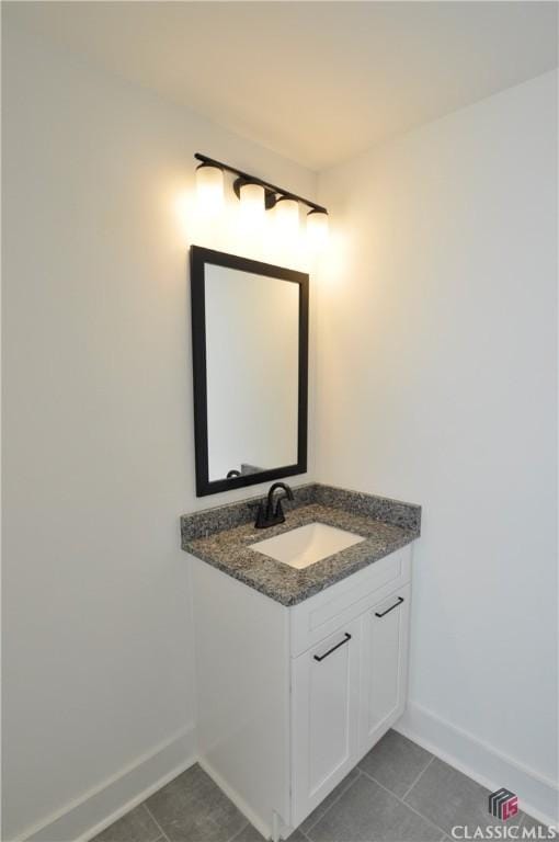 bathroom with vanity and tile patterned floors