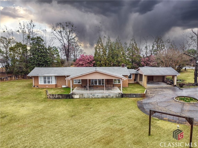 back of house featuring a patio and a yard