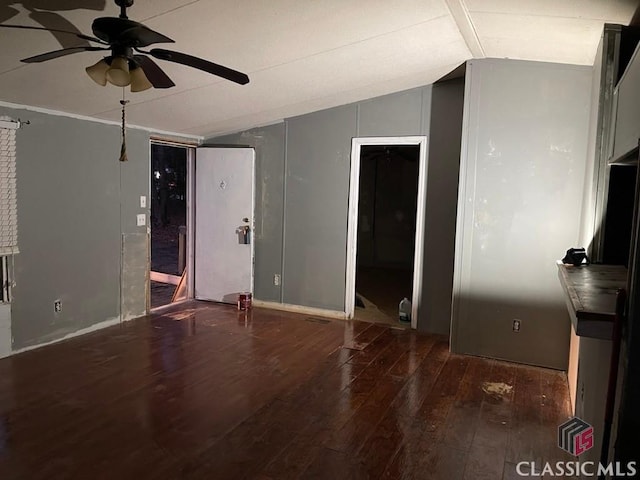 interior space with hardwood / wood-style flooring, vaulted ceiling, and a ceiling fan