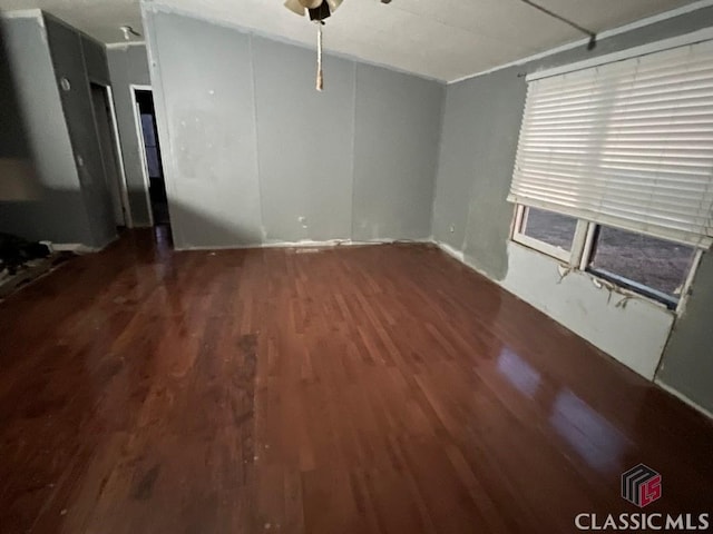 unfurnished living room with wood finished floors