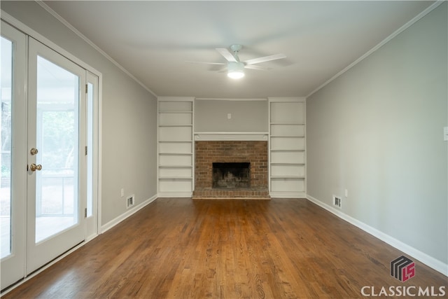 unfurnished living room with ornamental molding, ceiling fan, dark hardwood / wood-style flooring, and a fireplace