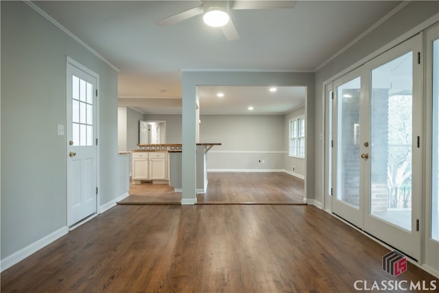 spare room featuring french doors, crown molding, ceiling fan, and dark hardwood / wood-style flooring