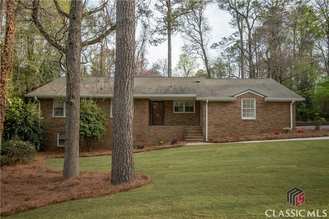 ranch-style house with a front lawn