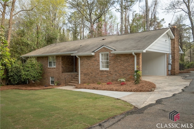 ranch-style home with a carport and a front yard