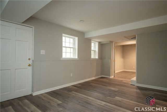 unfurnished room featuring dark hardwood / wood-style floors