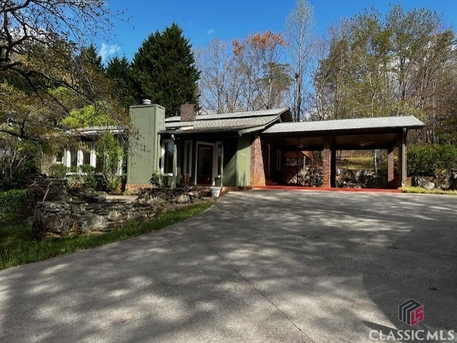 view of front of home featuring a carport