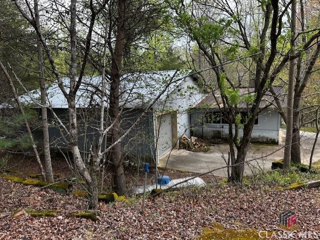 view of property exterior with a garage