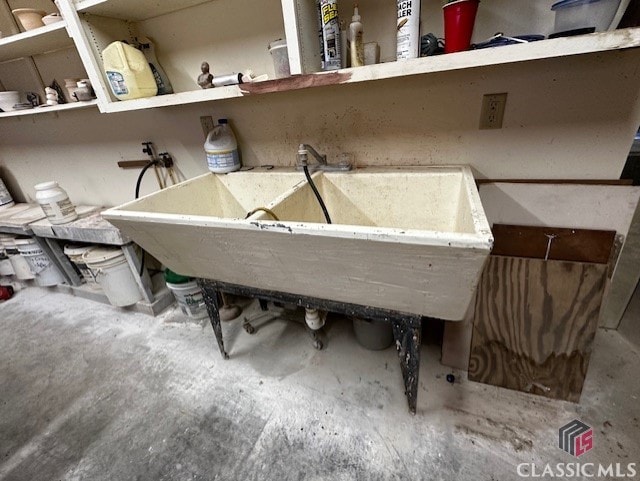 bathroom with sink and concrete floors