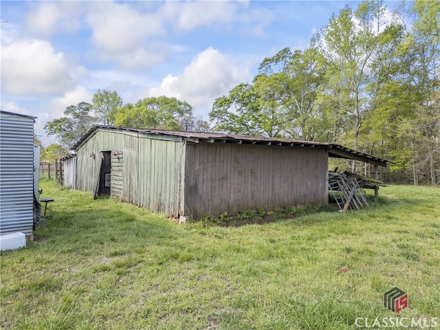 view of shed / structure with a lawn