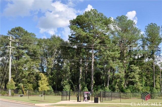 view of property's community with a lawn