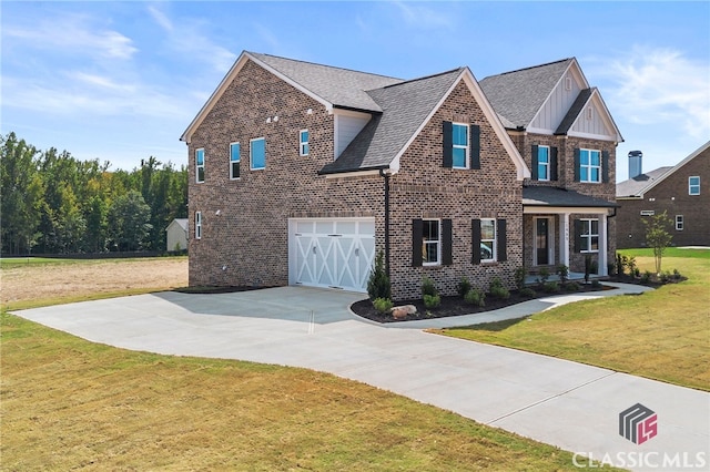 view of front of house with a garage and a front yard