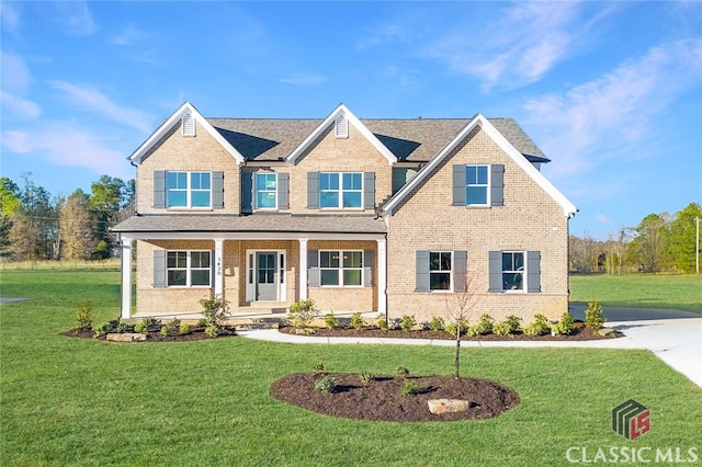 craftsman inspired home with covered porch and a front lawn