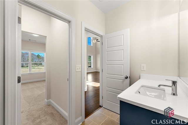 bathroom featuring vanity and tile floors