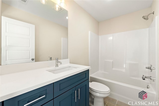 full bathroom with vanity, toilet, tile floors, and bathing tub / shower combination