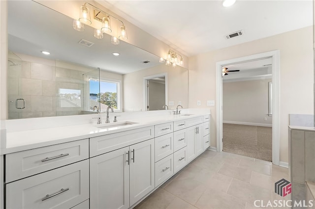 bathroom featuring tile flooring, oversized vanity, ceiling fan, and double sink